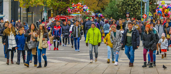 People walking on street in city