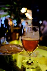 Close-up of beer in glass on table