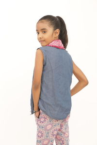 Girl standing against white background
