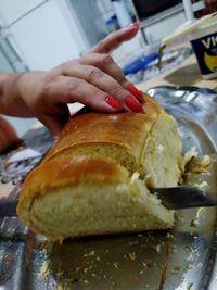 Close-up of person preparing food in kitchen