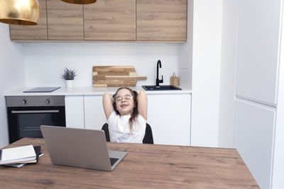 Woman using laptop on table