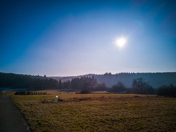 Scenic view of field against clear sky