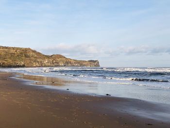 Scenic view of beach against sky