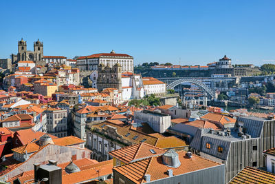 The old town of porto with the famous iron bridge in the back