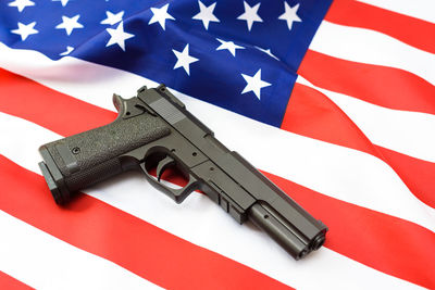 Low angle view of man holding american flag