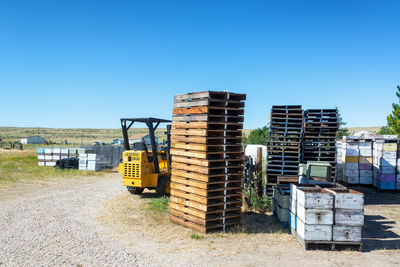 Built structure on field against clear blue sky