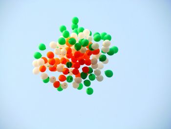 Close-up of colorful balloons against white background