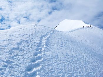 Scenic view of snow covered landscape against sky