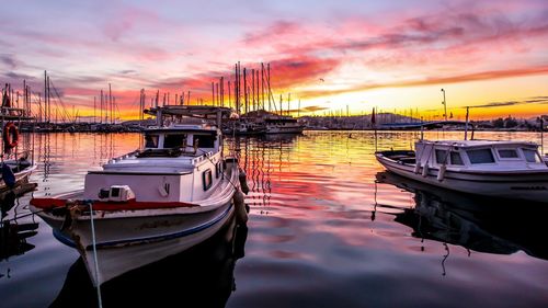 Boats moored at harbor