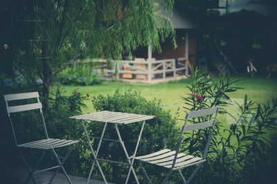 Chairs and table in swimming pool