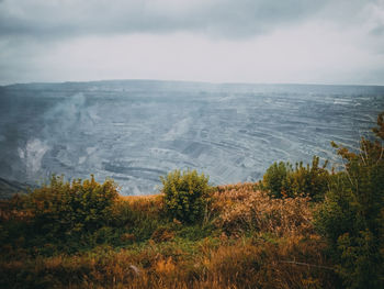 Scenic view of sea against cloudy sky