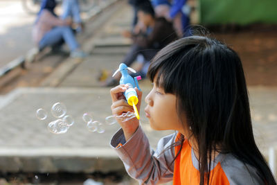 Portrait of girl with bubbles