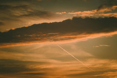 Low angle view of dramatic sky during sunset