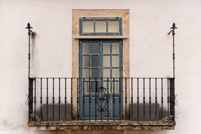 Serene balcony with lush greenery overlooking charming streets in lugo, spain