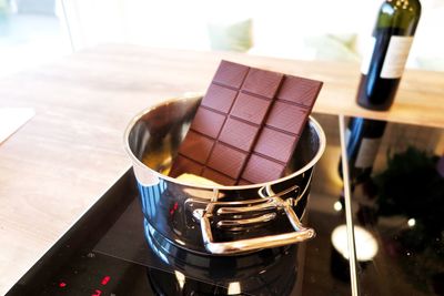 High angle view of chocolate in container on table