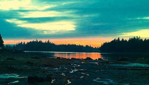 Scenic view of lake at sunset