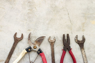 Close-up of rusty hand tools on table