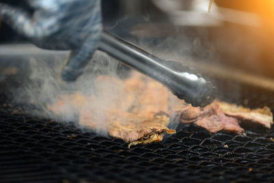 Close-up of meat on barbecue grill