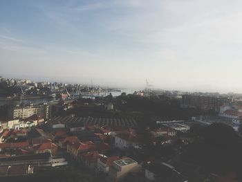 Cityscape against cloudy sky