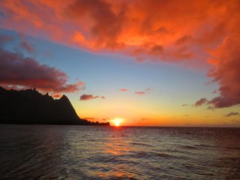 Scenic view of sea against orange sky