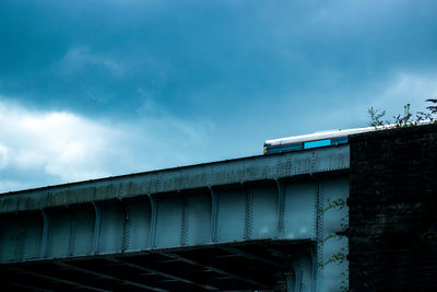 Low angle view of bridge against building