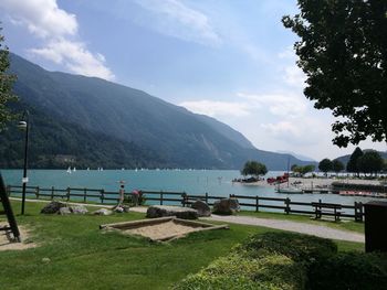 Scenic view of lake and mountains against sky