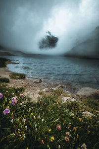 Scenic view of sea against cloudy sky