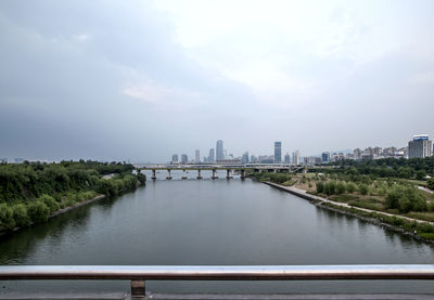 River by city against sky