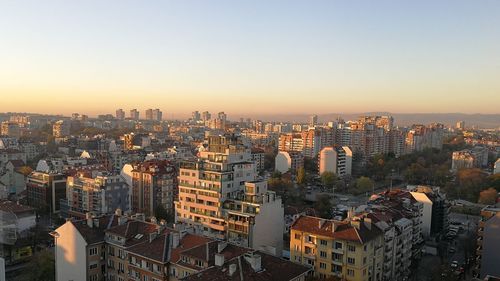 High angle view of buildings against sky during sunset