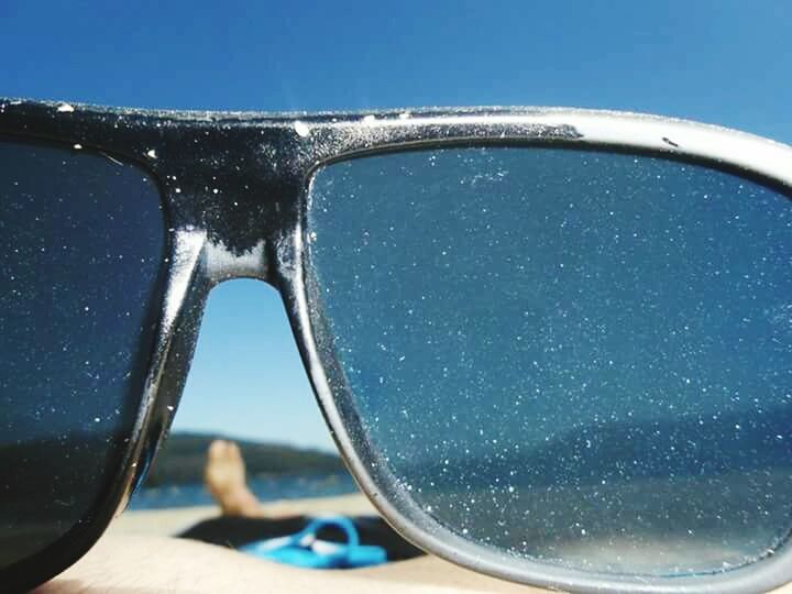 blue, water, close-up, clear sky, part of, transportation, transparent, sea, mode of transport, cropped, sky, drop, glass - material, day, focus on foreground, reflection, travel, nature, car, vehicle interior