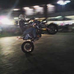 Person riding motorcycle on road