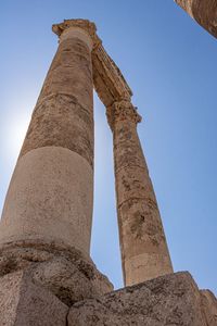 Low angle view of old ruins against sky