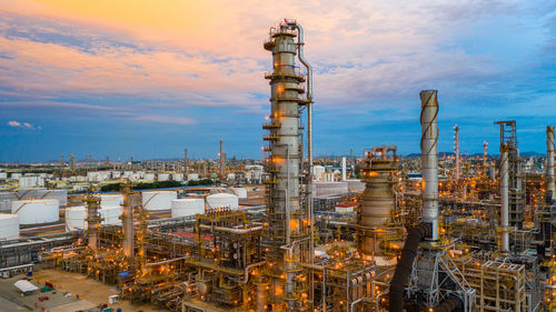 View of factory against cloudy sky