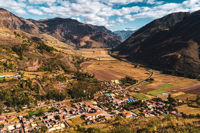 High angle view of townscape and mountains against sky