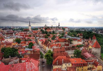 Cityscape against cloudy sky