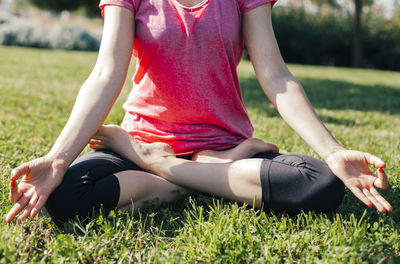 Young woman meditation, lotus position, hands