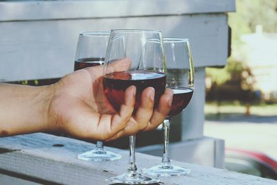 Close-up of man drinking glasses on table