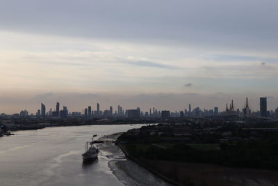 Panoramic view of buildings in city against sky