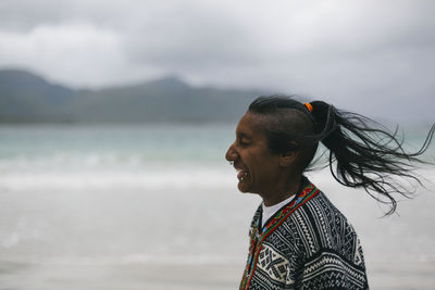 Laughing woman on beach