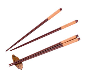 High angle view of chopsticks against white background