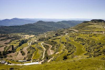 Scenic view of landscape and mountains against clear sky