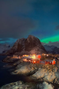 Scenic view of illuminated mountain against sky at night