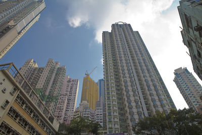 Low angle view of modern buildings against sky in city