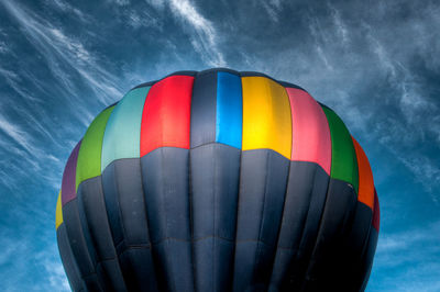 Low angle view of colorful balloons against sky