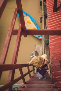 Woman on staircase by canal