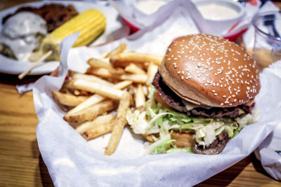 Close-up of burger and french fries on table