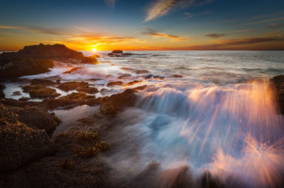 Scenic view of sea against sky during sunset