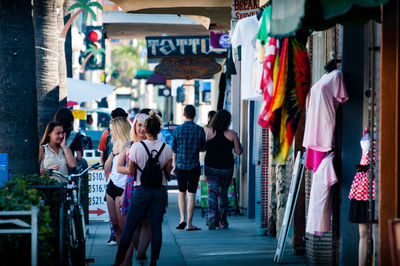 People standing on multi colored city street