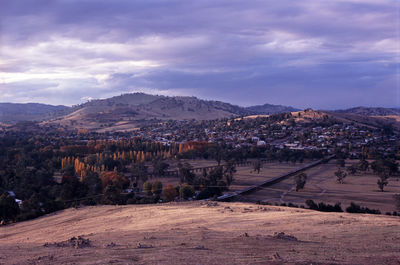 Scenic view of mountains against cloudy sky