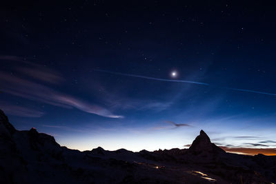 Low angle view of mountain against sky at night